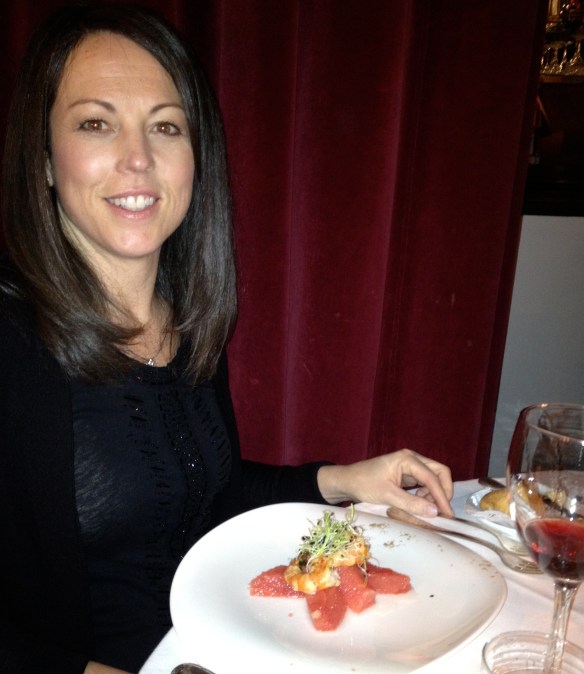 Gena in Paris with a leek microgreen-topped shrimp and grapefruit salad.