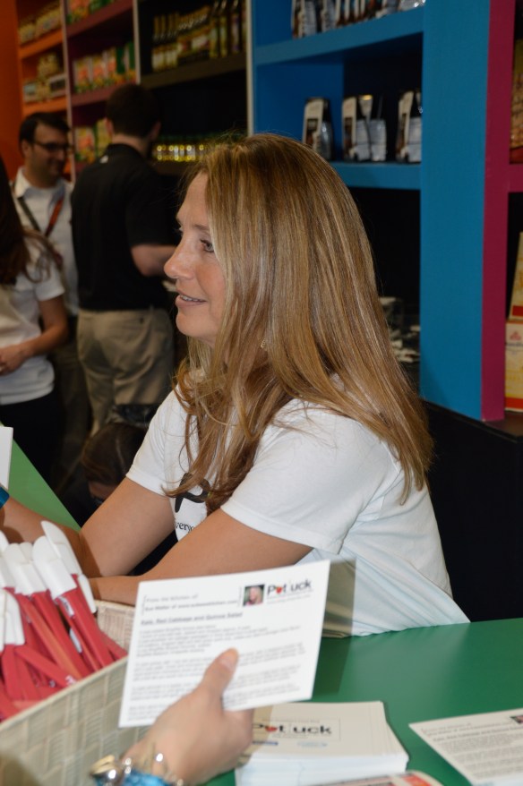 Me signing autographs at the ShopRite booth. (Kidding! Just telling people about the Potluck blog and handing out recipe cards.)