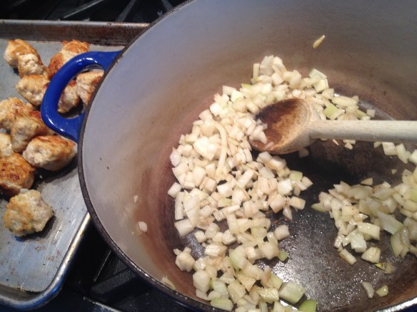Notice my browned but not totally cooked through meatballs waiting patiently on a baking sheet.