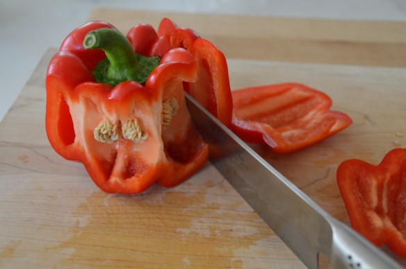 Cut around the core of bell peppers, then cut off the bottom. 
