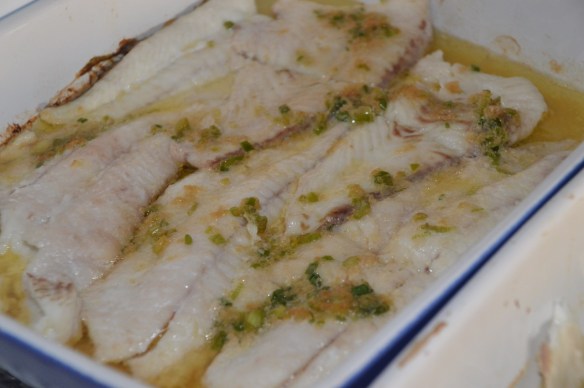 Baked fluke with white wine and ginger scallion butter.